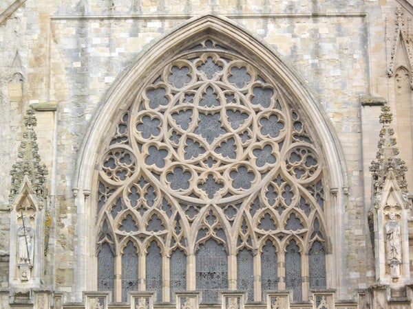 Gothic church window design detail.Detailed architecture of gothic church window facade.