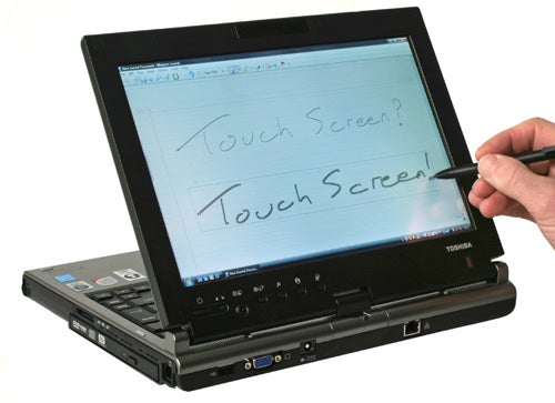 Toshiba Portege M700 with stylus on touchscreen in tablet modeHand using stylus on Toshiba Portege M700 touchscreen.