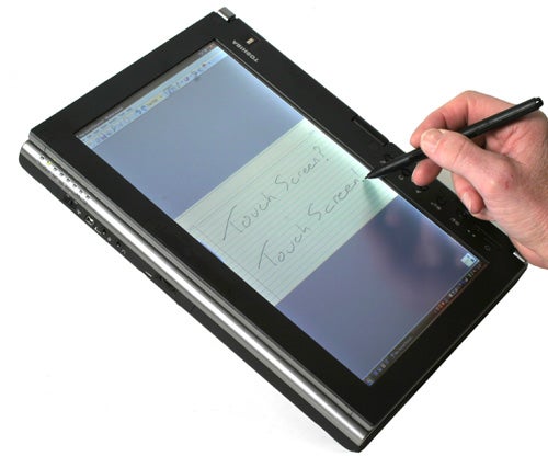 Hand writing on Toshiba Portege M700's touchscreen with stylus.