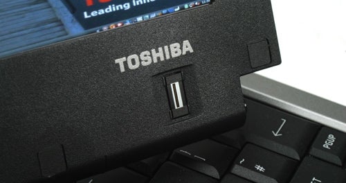 Close-up of Toshiba Portege M700 laptop hinge and keyboard.Close-up of Toshiba Portege M700 laptop's USB port and keyboard