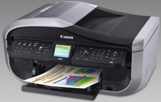 Canon PIXMA MX850 printer with printed color graphs.