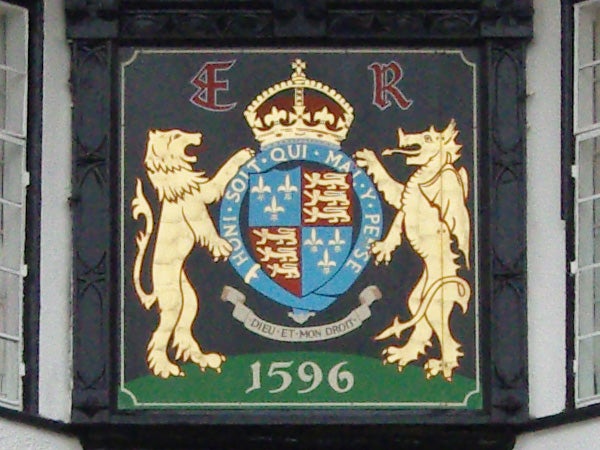 Coat of arms with lions and a crown, dated 1596.Coat of arms with lions and a crown displayed on a plaque.