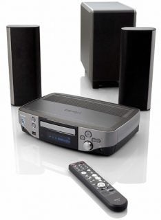 Denon S-302 DVD system with speakers and remote control.