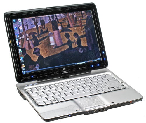 HP Pavilion tx2050ea laptop with screen rotated into tablet mode.