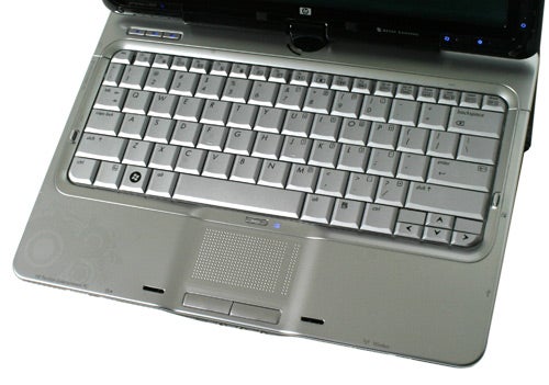 HP Pavilion tx2050ea laptop's keyboard and touchpad close-up.HP Pavilion tx2050ea laptop with open keyboard view.