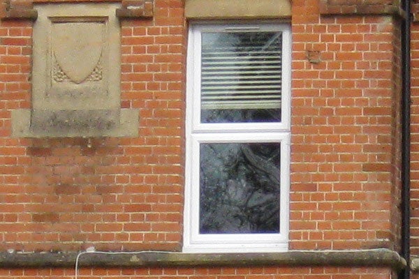 Photograph of a window in a brick building taken with Canon IXUS 90 IS.Photo sample from Canon IXUS 90 IS camera showing a window.
