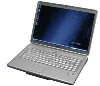 Dell Inspiron 1525 laptop with open lid on white background.