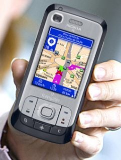Hand holding Nokia showing Route 66 Mobile 8 navigation screen.