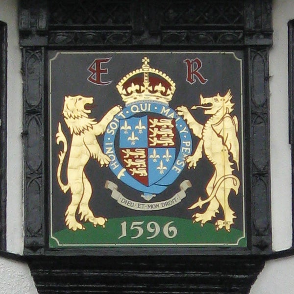 Historical coat of arms with lions and a shield from 1596.Coat of arms on a plaque with lions and a date from 1596.