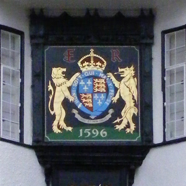 Coat of arms with crown, lions, and year 1596 on a plaque.Coat of arms with lions and a crown displayed on a plaque.