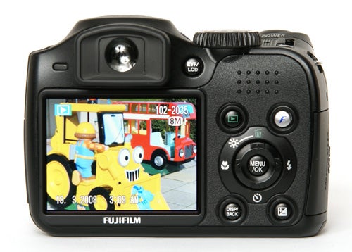 Fujifilm FinePix S5800 camera displaying colorful image on screen.Fujifilm FinePix S5800 digital camera with an image on display.