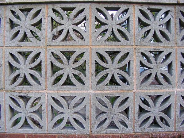 Decorative concrete block wall with geometric patterns.Decorative concrete block wall with symmetrical patterns