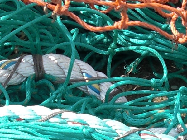 Close-up of colorful fishing nets and ropes textures.Close-up of tangled fishing nets with varying textures and colors.