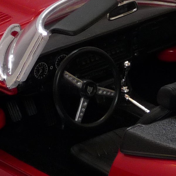 Close-up of a car's interior dashboard and steering wheel.Close-up of a classic car's steering wheel and dashboard.