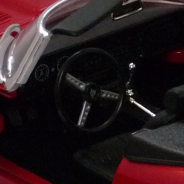 Close-up of a vintage car's steering wheel and dashboard.Interior of a vintage car with steering wheel and dashboard.