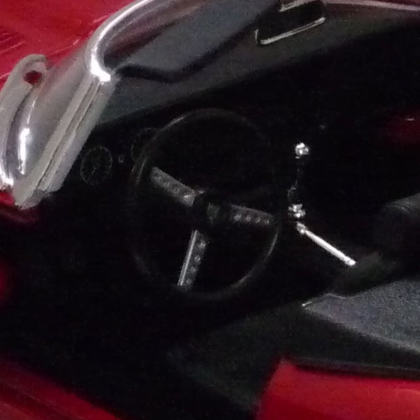 Close-up of a car's steering wheel and dashboard.Car interior with steering wheel and dashboard visible.