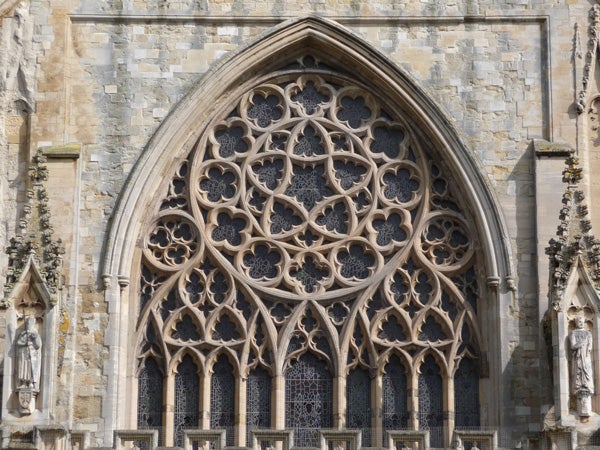 Detailed photo of Gothic architecture rose windowDetailed stone window tracery on Gothic cathedral facade.