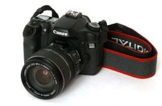 Canon EOS 40D DSLR camera with lens and strap.