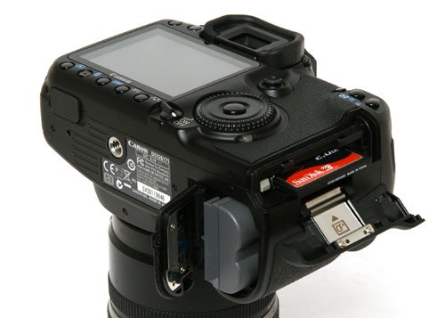Canon EOS 40D DSLR with open memory card slot.