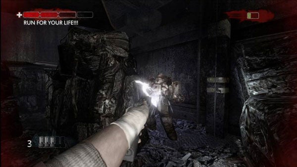 First-person view in Condemned 2: Bloodshot with gun firing.First-person view in Condemned 2: Bloodshot with gun firing at enemy.