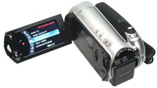 Toshiba Gigashot A100FE camcorder with LCD screen displayed.Toshiba Gigashot A100FE camcorder with open LCD screen.