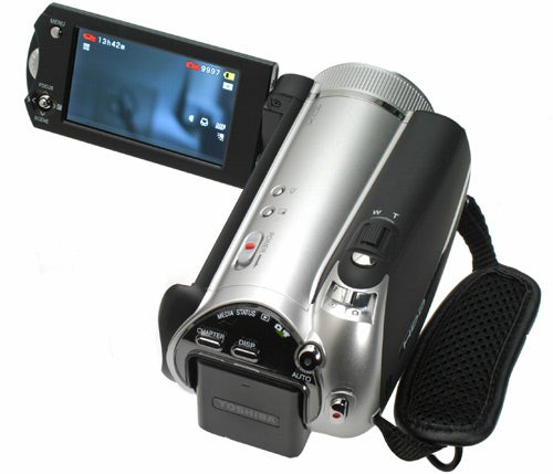 Toshiba Gigashot A100FE camcorder with hand strap displayedToshiba Gigashot A100FE camcorder with LCD screen and strap.