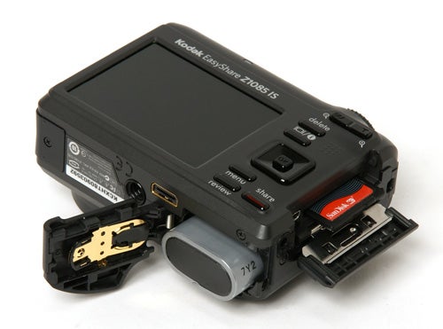 Kodak EasyShare Z1085 IS camera with open battery compartment.