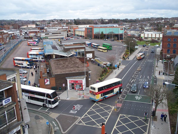 High-angle view of urban street with buses and carsAerial view of a town with buses and roads taken with Kodak camera.