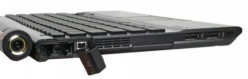 Sony VAIO VGN-TZ31MN notebook with USB dongle connected.Side view of Sony VAIO VGN-TZ31MN laptop with USB drive inserted.