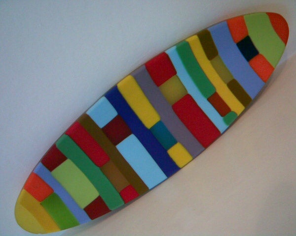 Colorful abstract surfboard design on white backgroundColorful surfboard with abstract design on white background.