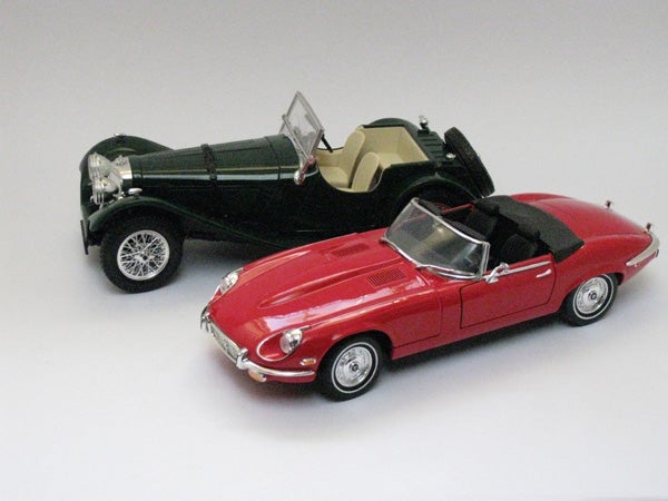 Two classic model cars on a white background.Two model cars on a white background
