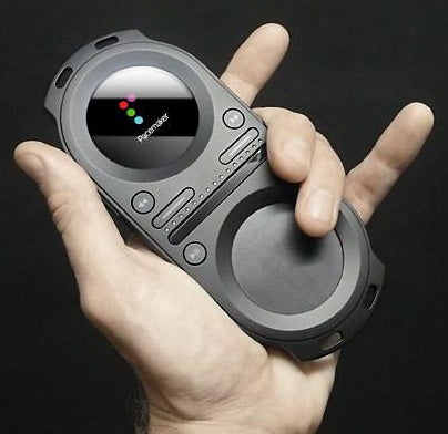 Hand holding a Tonium Pacemaker portable DJ device.