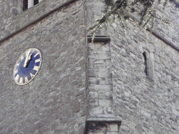 Olympus mju 1030 SW camera photo of an old clock tower.Clock on ancient stone tower taken with Olympus mju 1030 SW.