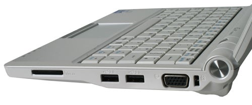 Asus Eee PC 900 netbook side ports and keyboard detail.Side view of Asus Eee PC 900 showing ports and keyboard.