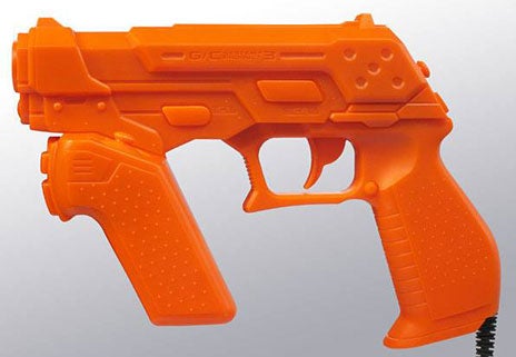 Orange light gun controller for Time Crisis 4 video game.Orange light gun controller for Time Crisis 4 game.