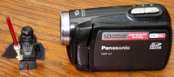 Panasonic SDR-S7 camcorder next to a Lego Darth Vader figure.Panasonic SDR-S7 camcorder next to LEGO Darth Vader figure.