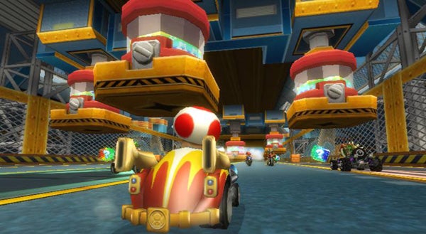 Screenshot of Mario Kart Wii gameplay with Toad racing.Mario Kart Wii gameplay screenshot with race in progress.