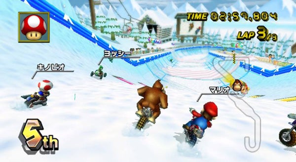 Screenshot of Mario Kart Wii gameplay with characters racing.Mario Kart Wii gameplay screenshot with characters racing on snow track.