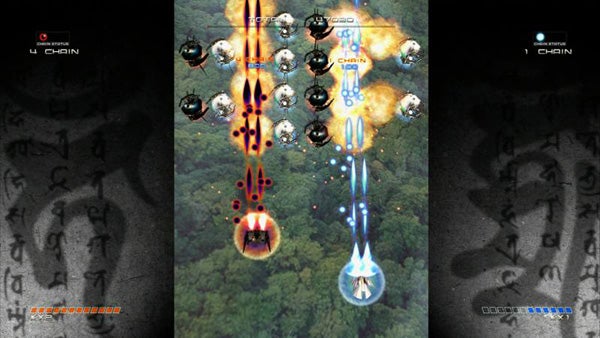 Screenshot of Ikaruga game showing colorful bullet patterns.Screenshot of Ikaruga game showing two ships and bullet patterns.