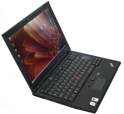 Lenovo ThinkPad X300 laptop open on desk.Lenovo ThinkPad X300 laptop open on a white surface.