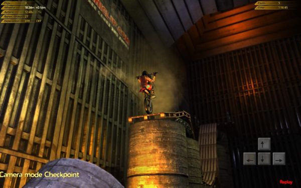 Motocross rider jumping over barrels in Trials 2 game.Motorcycle performing a stunt in Trials 2: Second Edition game.