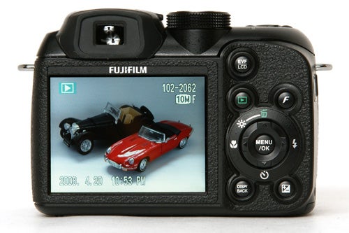 Fujifilm FinePix S1000fd camera displaying a photo on screenFujifilm FinePix S1000fd display showing photographed toy cars.