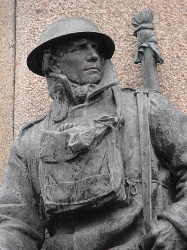 Close-up of a bronze soldier statue with detailed textures.