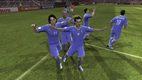 Virtual soccer players celebrating a goal in a video game.Screenshot of UEFA Euro 2008 video game celebration scene