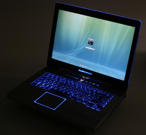 Alienware Area-51 m15x laptop with illuminated keyboard and screen.Alienware Area-51 m15x laptop with blue backlit keyboard.
