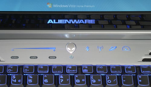 Alienware Area-51 m15x laptop keyboard and touchpad controls.Alienware Area-51 m15x keyboard with backlit keys and touch controls.