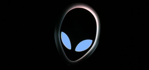 Alienware Area-51 m15x logo illuminated on laptop cover.Alienware logo illuminated on dark background