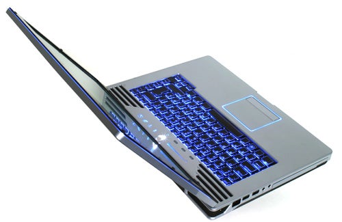 Alienware Area-51 m15x laptop with blue backlit keyboard open at an angle.Alienware Area-51 m15x laptop with illuminated keyboard open at an angle