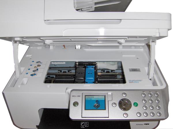 Lexmark X9575 printer with open scanning unitLexmark X9575 printer opened showing ink cartridges and controls.
