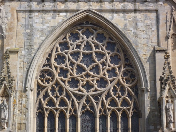Detailed gothic window architecture with intricate stonework.Detailed architecture of a Gothic church window.